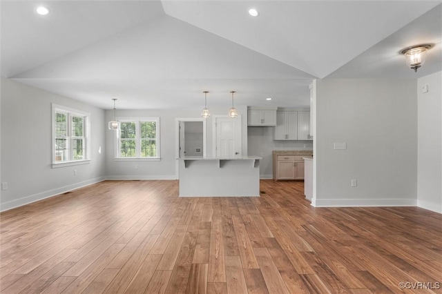 699 Trimmers Shop Rd, King William, VA 23181 - unfurnished living room with vaulted ceiling, light wood-style flooring, and recessed lighting