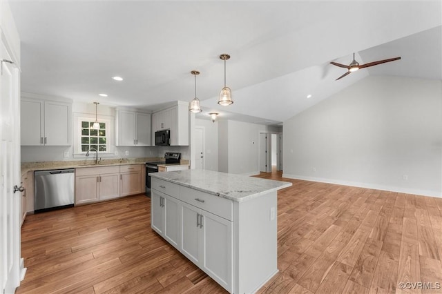 699 Trimmers Shop Rd, King William, VA 23181 - kitchen featuring stainless steel dishwasher, range with electric cooktop, black microwave, a kitchen island, and light wood-style flooring