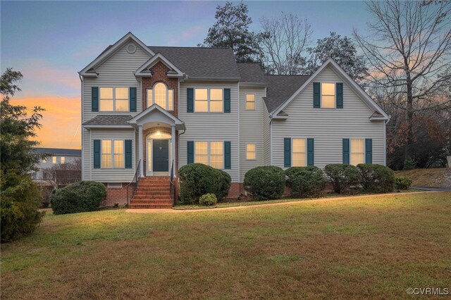 14313 Woodleigh Dr, Chester, VA 23831 - traditional-style home featuring a front lawn and roof with shingles