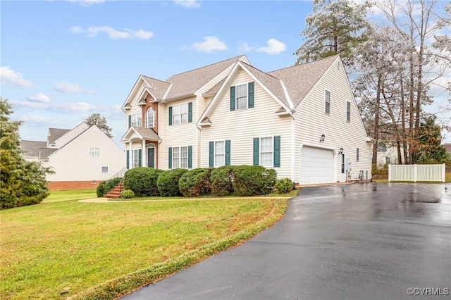 14313 Woodleigh Dr, Chester, VA 23831 - view of front facade with driveway, a garage, a front lawn, and a shingled roof