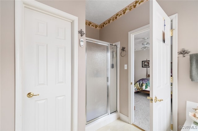 14313 Woodleigh Dr, Chester, VA 23831 - ensuite bathroom with a shower stall, a ceiling fan, and a textured ceiling