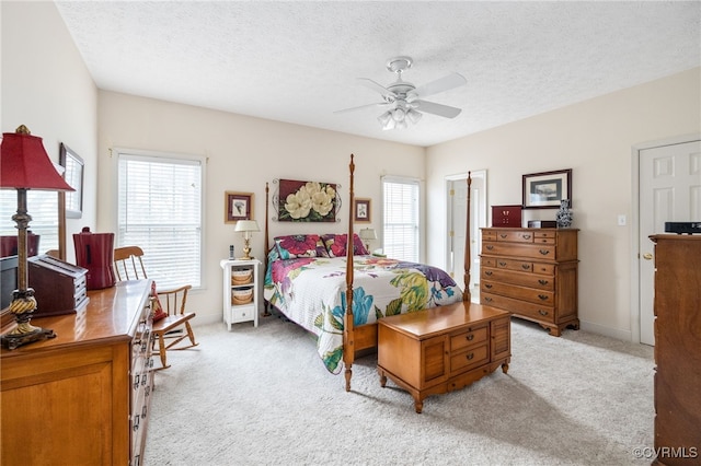 14313 Woodleigh Dr, Chester, VA 23831 - bedroom featuring light carpet, multiple windows, a textured ceiling, and ceiling fan