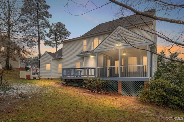 14313 Woodleigh Dr, Chester, VA 23831 - rear view of house featuring a sunroom, a deck, roof with shingles, and a yard