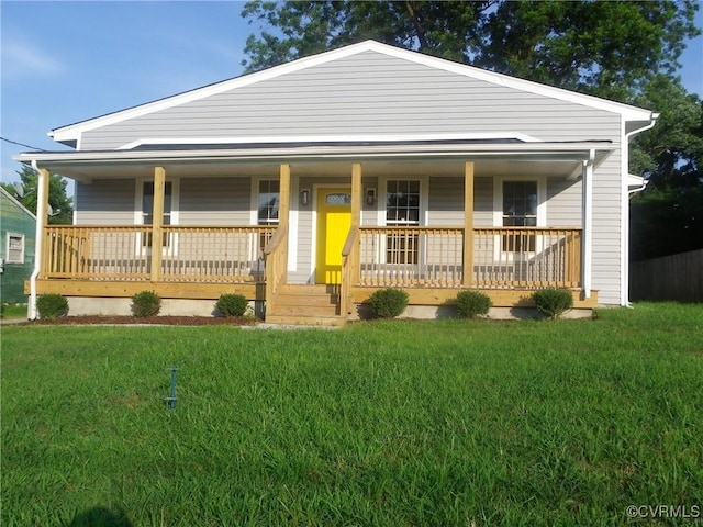 1120 Halifax St, Petersburg, VA 23803 - view of front facade featuring covered porch and a front lawn