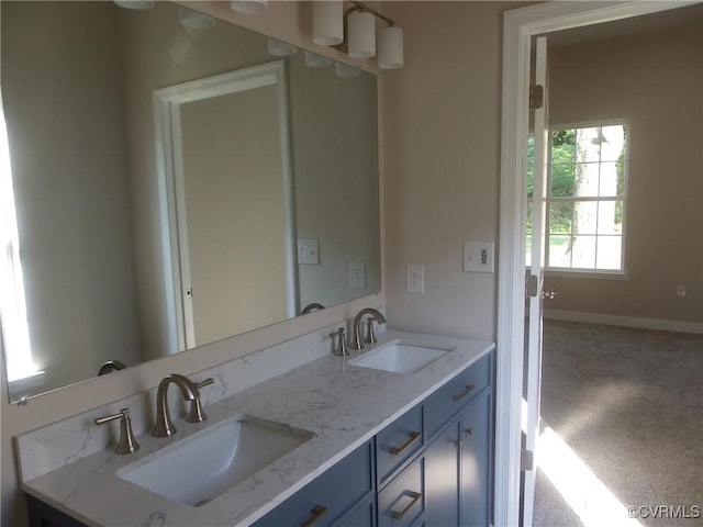 1120 Halifax St, Petersburg, VA 23803 - bathroom featuring double vanity and baseboards