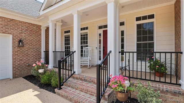 5080 Brandon Pines Way, Providence Forge, VA 23140 - doorway to property with a porch, roof with shingles, and brick siding