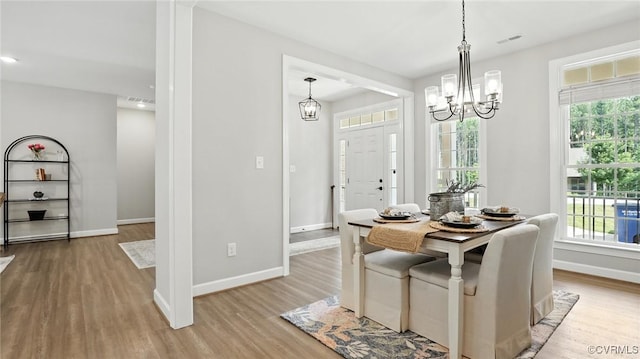 5080 Brandon Pines Way, Providence Forge, VA 23140 - dining area with wood finished floors and a chandelier