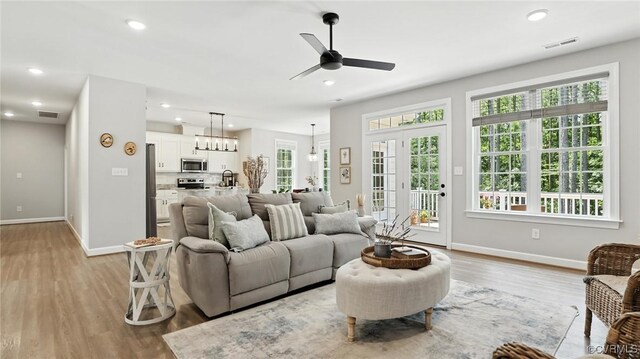 5080 Brandon Pines Way, Providence Forge, VA 23140 - living area featuring ceiling fan, light wood finished floors, a chandelier, and recessed lighting