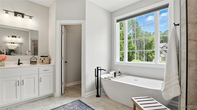 5080 Brandon Pines Way, Providence Forge, VA 23140 - bathroom featuring vanity and a freestanding tub