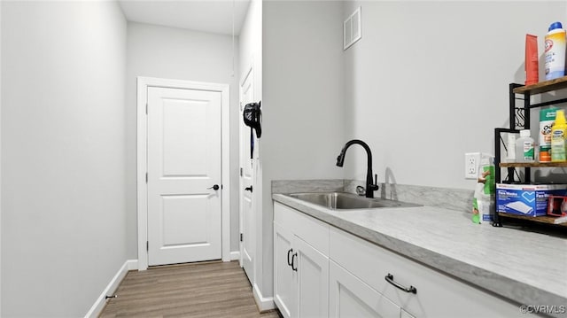 5080 Brandon Pines Way, Providence Forge, VA 23140 - bar area featuring a sink and light wood-style flooring