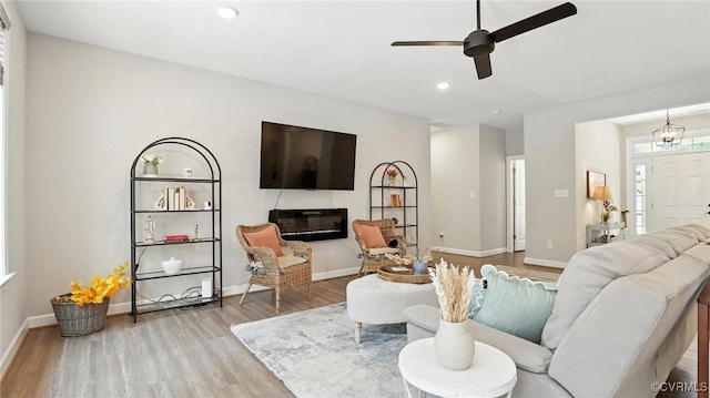 5080 Brandon Pines Way, Providence Forge, VA 23140 - living area featuring wood finished floors, a ceiling fan, a glass covered fireplace, and recessed lighting
