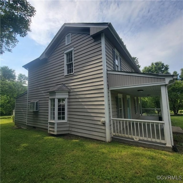 9210 Park St, Amelia Courthouse, VA 23002 - view of home's exterior with a lawn, a porch, and a wall mounted AC
