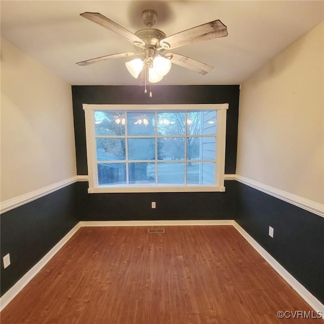 9210 Park St, Amelia Courthouse, VA 23002 - unfurnished room featuring wood finished floors, plenty of natural light, and a ceiling fan