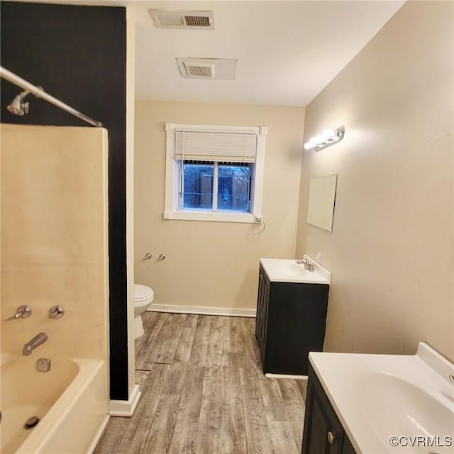 9210 Park St, Amelia Courthouse, VA 23002 - bathroom with vanity, wood finished floors, and tub / shower combination