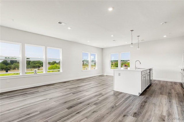 3900 Maze Runner Dr Unit 205, Chesterfield, VA 23112 - unfurnished living room featuring wood finished floors and recessed lighting
