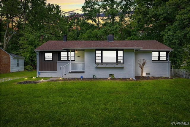520 Heth Rd, Petersburg, VA 23805 - single story home with a chimney, a front lawn, brick siding, and roof with shingles