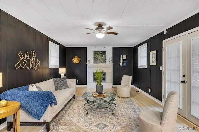 520 Heth Rd, Petersburg, VA 23805 - living area with light wood-style flooring, ceiling fan, a fireplace, and ornamental molding