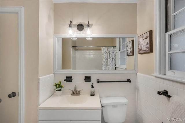 520 Heth Rd, Petersburg, VA 23805 - full bath with vanity, a shower with shower curtain, and tile walls