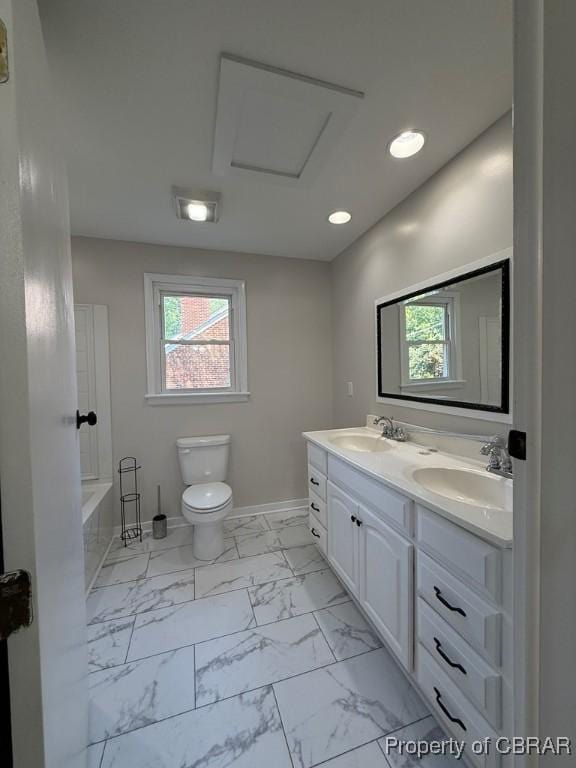 36 Roseneath Ave, Kilmarnock, VA 22482 - full bathroom with healthy amount of natural light, marble look tiles, double vanity, a tub, and recessed lighting