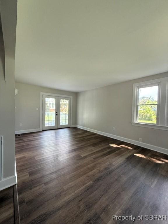 36 Roseneath Ave, Kilmarnock, VA 22482 - empty room featuring healthy amount of natural light, dark wood finished floors, and french doors