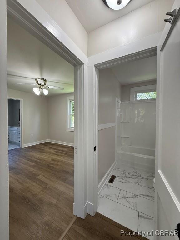 36 Roseneath Ave, Kilmarnock, VA 22482 - full bath featuring plenty of natural light, a tub, a ceiling fan, and marble look tile flooring