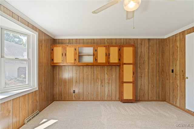 2411 Colwyn Rd, Henrico, VA 23229 - unfurnished room with wood walls, a ceiling fan, light colored carpet, and ornamental molding