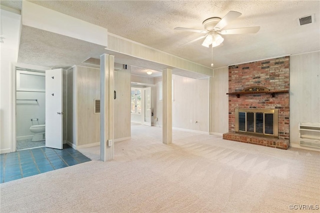 2411 Colwyn Rd, Henrico, VA 23229 - unfurnished living room featuring a textured ceiling, carpet flooring, ceiling fan, and a fireplace