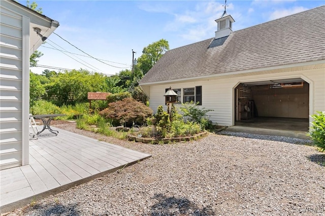 2411 Colwyn Rd, Henrico, VA 23229 - view of side of home with a garage, roof with shingles, and driveway