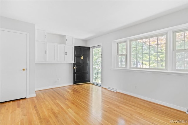 2411 Colwyn Rd, Henrico, VA 23229 - unfurnished bedroom featuring light wood-type flooring and baseboards