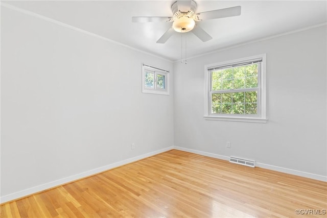 2411 Colwyn Rd, Henrico, VA 23229 - empty room featuring plenty of natural light, light wood-style floors, ornamental molding, and a ceiling fan