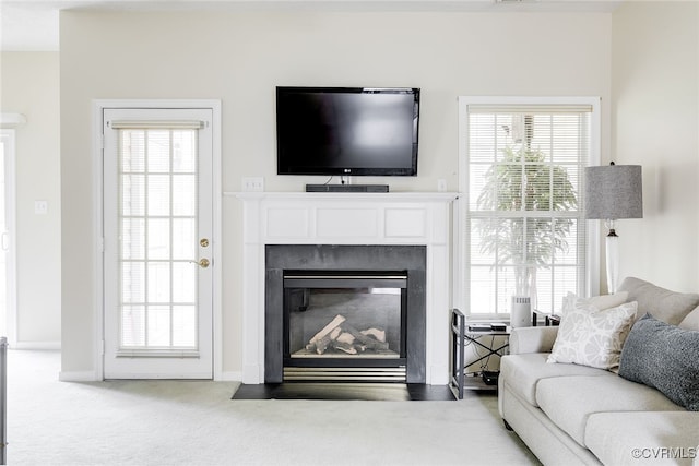4017 Bayapple Dr, Henrico, VA 23294 - carpeted living area featuring a fireplace with flush hearth and healthy amount of natural light