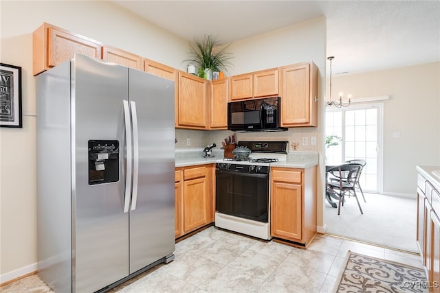 4017 Bayapple Dr, Henrico, VA 23294 - kitchen featuring stainless steel fridge with ice dispenser, range with gas cooktop, black microwave, light countertops, and a chandelier
