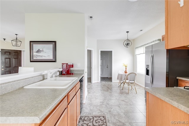 4017 Bayapple Dr, Henrico, VA 23294 - kitchen featuring decorative light fixtures, light countertops, dishwashing machine, and a chandelier