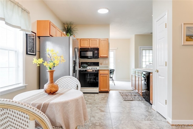 4017 Bayapple Dr, Henrico, VA 23294 - kitchen with black appliances, light brown cabinetry, and light countertops