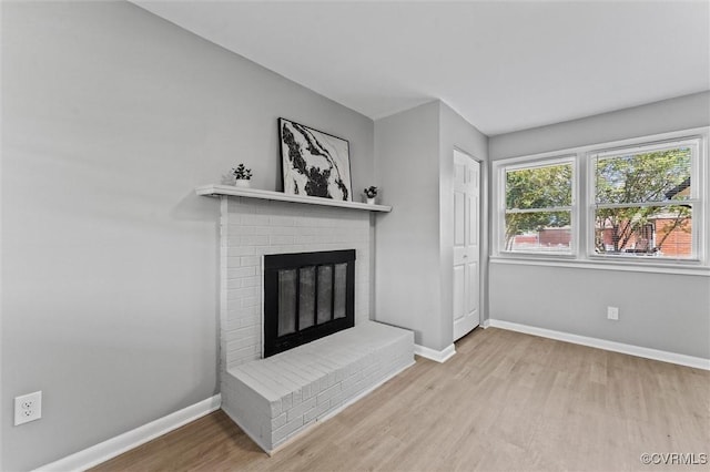 2000 Cleary Rd, Richmond, VA 23223 - unfurnished living room featuring wood finished floors and a fireplace