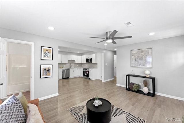 2000 Cleary Rd, Richmond, VA 23223 - living area featuring a ceiling fan, light wood finished floors, and recessed lighting