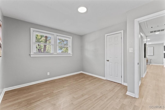 2000 Cleary Rd, Richmond, VA 23223 - unfurnished bedroom with attic access and light wood-style flooring