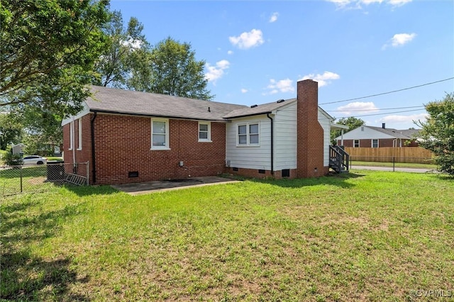 2000 Cleary Rd, Richmond, VA 23223 - rear view of house featuring crawl space, a chimney, and a patio area