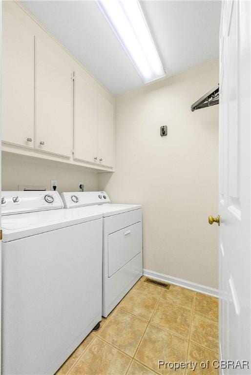 10 Heatherfield Ct Unit 10, Kilmarnock, VA 22482 - laundry room featuring cabinet space, washer and clothes dryer, and light tile patterned flooring