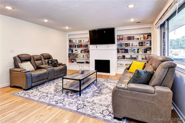 107 Ward, Hampton, VA 23669 - living area featuring wood finished floors and a brick fireplace