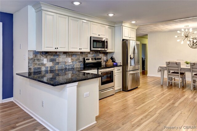 107 Ward, Hampton, VA 23669 - kitchen featuring appliances with stainless steel finishes, a chandelier, white cabinets, light wood-style floors, and recessed lighting