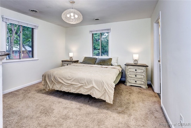 107 Ward, Hampton, VA 23669 - bedroom featuring carpet floors, multiple windows, and a chandelier
