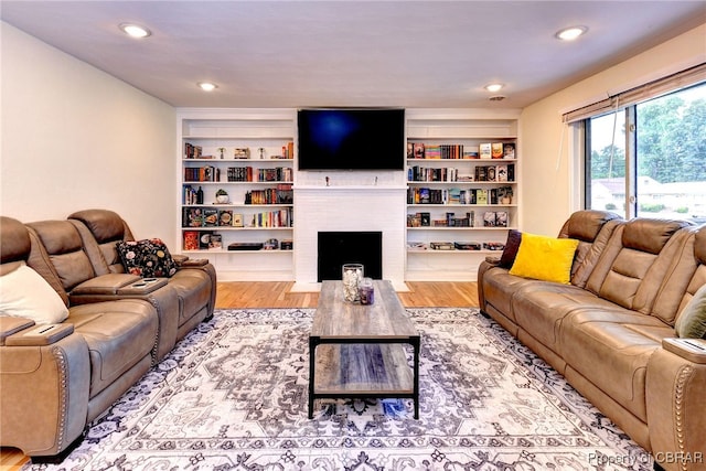 107 Ward, Hampton, VA 23669 - living area with wood finished floors, a fireplace, and recessed lighting