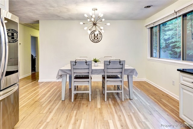 107 Ward, Hampton, VA 23669 - dining space featuring a chandelier and light wood finished floors