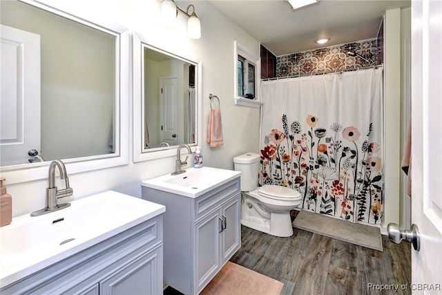 107 Ward, Hampton, VA 23669 - bathroom featuring two vanities, wood finished floors, and curtained shower