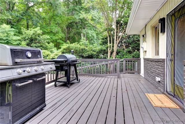 107 Ward, Hampton, VA 23669 - wooden deck featuring grilling area and a forest view