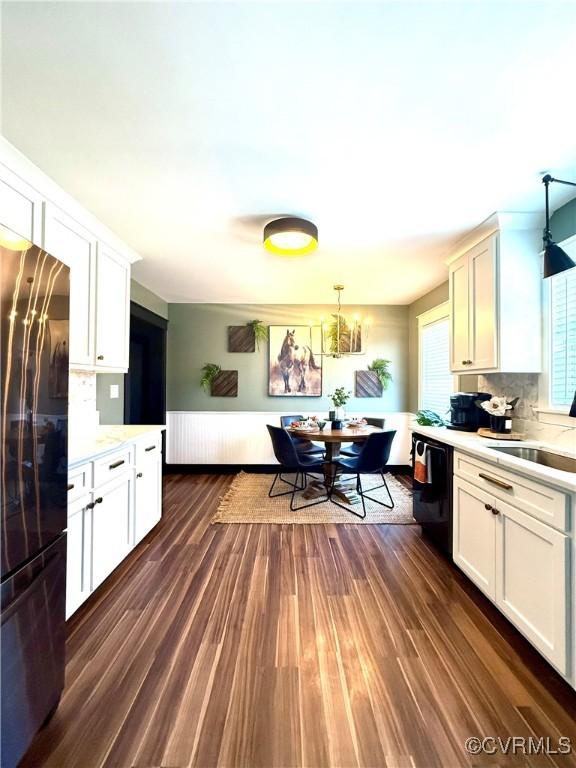 5754 Fox Maple Ter, Chesterfield, VA 23803 - kitchen featuring black appliances, light countertops, dark wood-style floors, and tasteful backsplash
