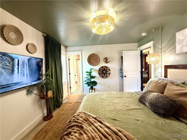 5754 Fox Maple Ter, Chesterfield, VA 23803 - bedroom with a chandelier, carpet, and ensuite bathroom