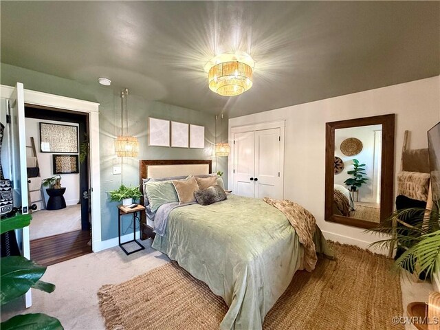5754 Fox Maple Ter, Chesterfield, VA 23803 - bedroom with a closet, a chandelier, and light colored carpet