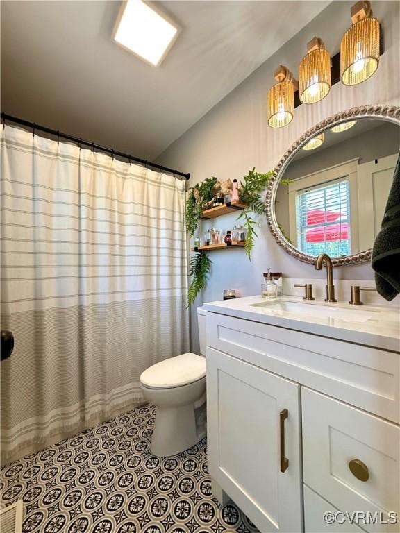 5754 Fox Maple Ter, Chesterfield, VA 23803 - bathroom with vanity and a shower with shower curtain